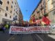 Corteo a Roma contro il governo bandiere rosse e della Palestina a piazza Vittorio